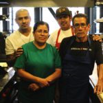 Villa Esondida owner Jose Perez and family members in the restaurant kitchen.