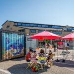 Group enjoying the Waterfront Pop-ups during a sunny day