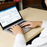 Person filling out an online application form